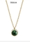 OEMの緑の円形の石の吊り下げ式のネックレスの金のステンレス製のトルクの宝石類のネックレス