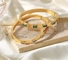 立方ジルコニアの石によって蝶番を付けられるギフトが付いている18のK愛友情のブレスレットの腕輪の金